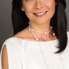 Mung-Ling Tsui as Travel Agent