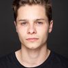 Toby Wallace as Moses