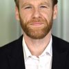 Brian Gleeson as Merlin