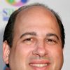 Michael Kostroff as Chairman Warner
