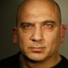 Jonny Coyne as Priest 2