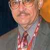 R. Allen Leider as Man at party