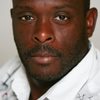Marvin Campbell as Simon