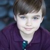 Liam Hughes as Caleb Baker