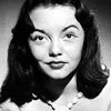 Gloria Saunders as Cigarette Clerk