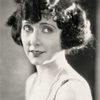 Mae Busch as Miss Tyson