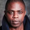 Okezie Morro as Simon