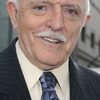 John Astin as Minister