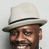 Malcolm Barrett as Reggie X