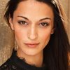 Sara Tomko as Reporter