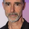 Finbar Lynch as Professor Greenwood