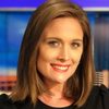 Meghan Packer as TV Anchor