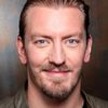 Darrel Cherney as Detective Grate