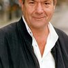 Michael Elphick as Inspector Huish