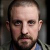 Simon Shorten as Ulysses Suite Police Officer 1