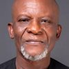 Toyin Oshinaike as Baba