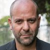 Udi Razzin as Police officer