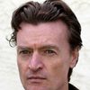 Anthony Brophy as Sir Malcolm Reid
