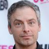 Justin Kirk as Adam