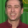 Corey Burton as Reverend Henry Kane (voice) (uncredited)