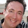 Pete Sepenuk as Radio Announcer (voice)