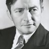 Claude Rains as Alexander Hollenius