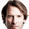 Adrian Hough as Father Robert Malone