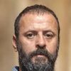 Ali Suliman as Syrian Officer
