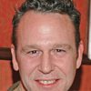 John Costelloe as Warren Hurley