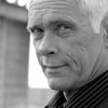 Paul Dillon as Leonide "the Hacker" Volkov