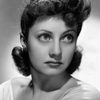 Diana Lewis as Miss Dunk