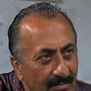 Claudio Nicastro as The Party Secretary