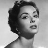 Dana Wynter as Morgan Le Fay's servant (uncredited)