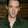 J. Adam Brown as Kyle the Photographer