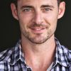 David Vaughn as Frank Turner
