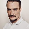 Pierre Lottin as Wilfried Tuche