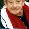 Derek Fowlds as Sun Bathing Man