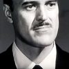 William Woodson as Warden