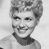 Judy Holliday as Laura Partridge