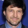Tim Guinee as OHH Officer