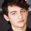 Julian Shatkin as Reggie