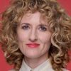 Amber Sealey as Casting Director