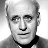 Alastair Sim as Mr. Greig