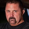 Kane Hodder as Ed Gein