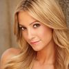 Nikki BreAnne Wells as Newscaster