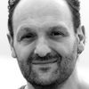 Daren Elliott Holmes as Simon the Garage Manager