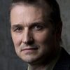 Jonathan Goad as The Voice / Mr. White