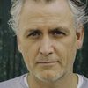 Julian Nicholson as Adam