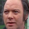 John Stratton as Asylum Director