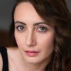 Julia Messina as TV Reporter